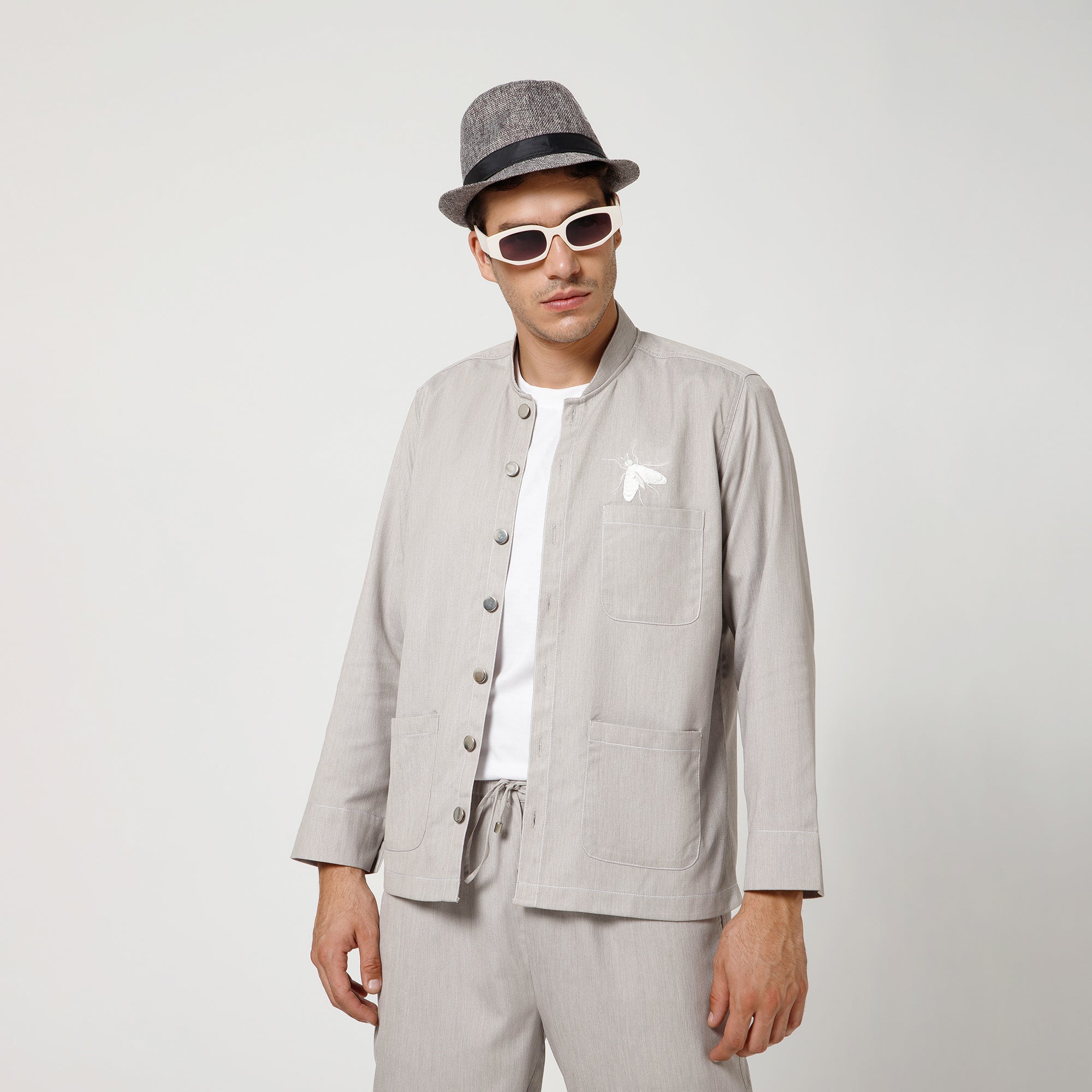 Grey Denim Jacket With White Top Stitch And White Fly