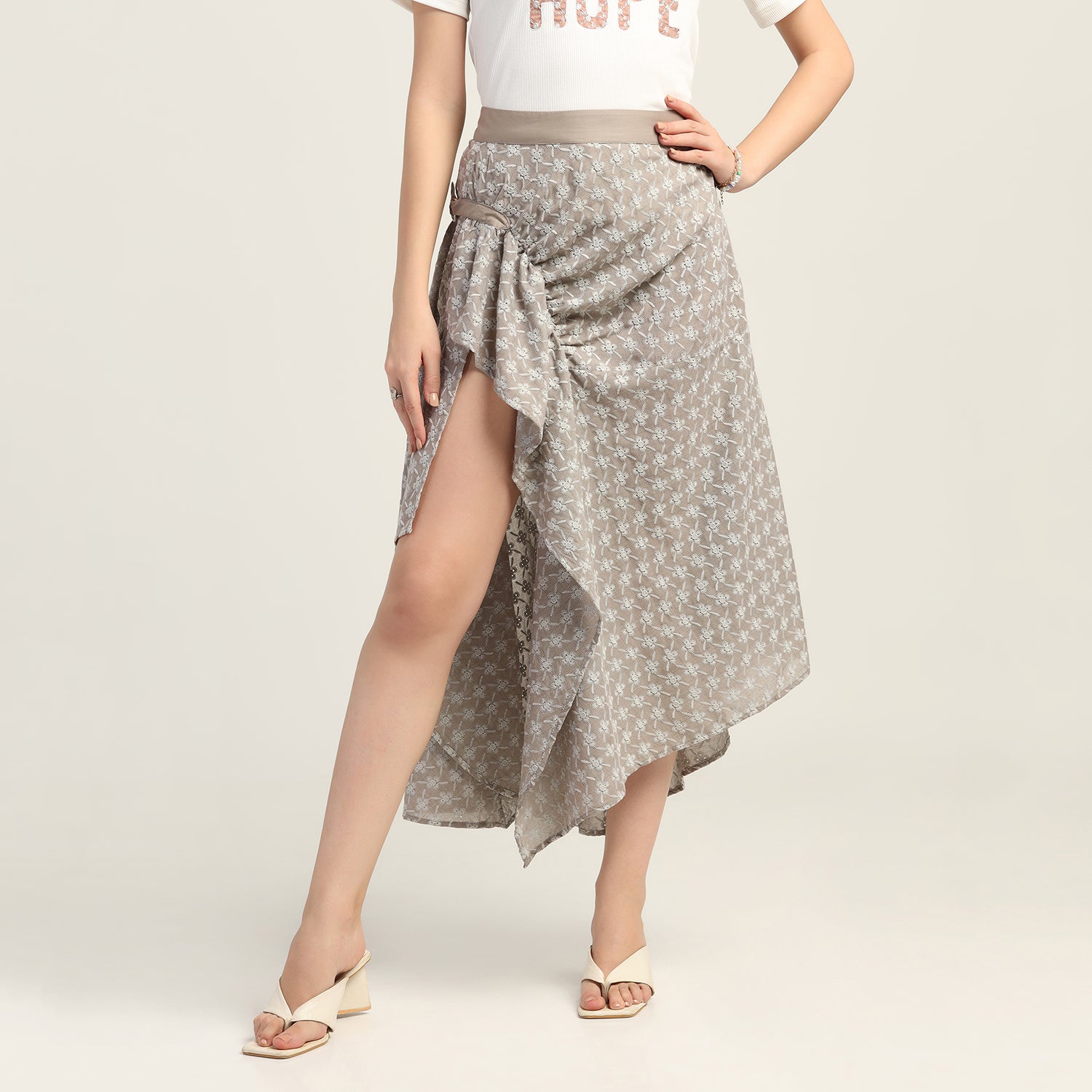 Taupe Schiffle Buckle Asymmetrical Skirt, skirts for women, long skirts for women, crop top and skirt, women in short skirts